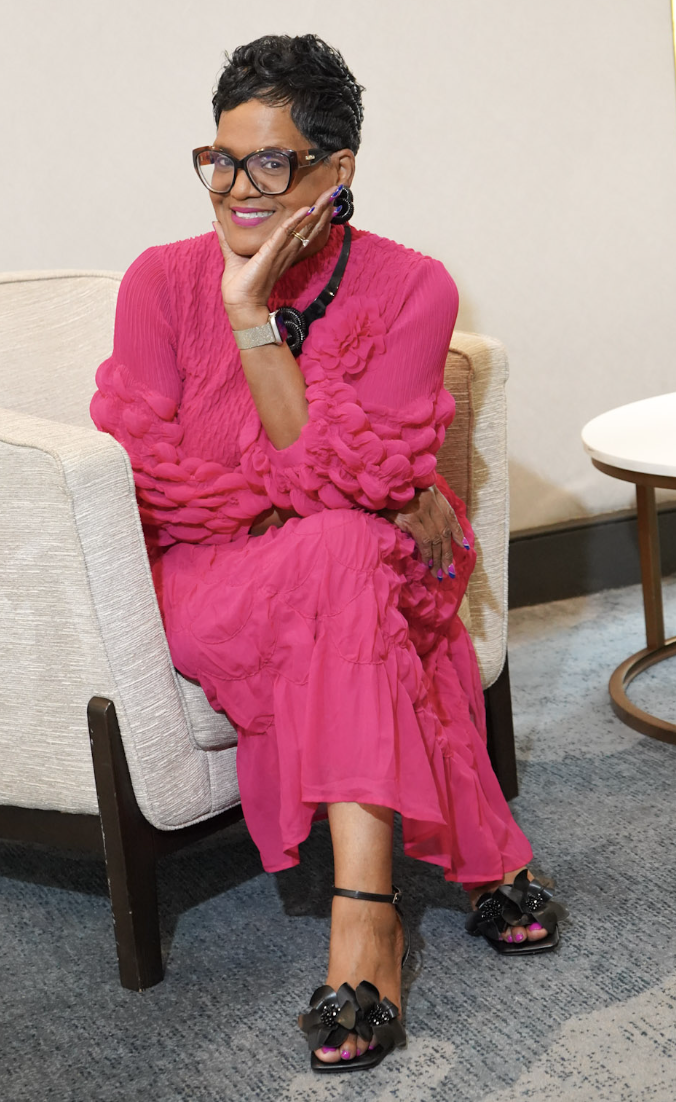 Dr. Mason-Underdue seated and smiling